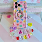 Candy hearts phone charm with translucent rainbow heart beads and crystal accents on conversation hearts phone case

