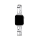 Axiom Link stainless steel Apple Watch band with Greek key cut-out pattern in brushed silver finish on a woman's wrist