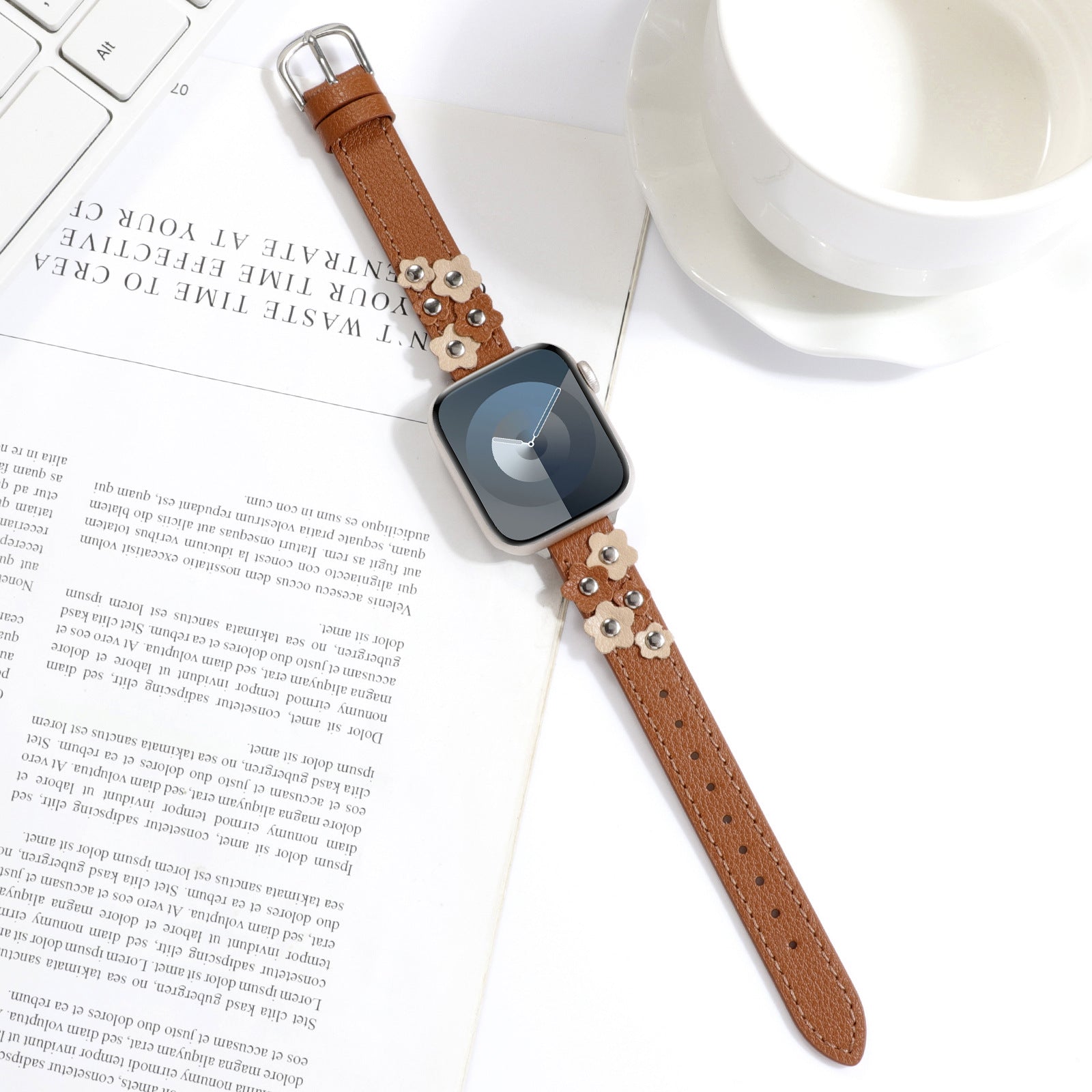 Sweet Saddle slim leather Apple Watch band in saddle tan with floral leather appliqués and silver studs
