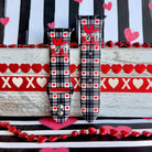 Plaid Crush Vibes Apple Watch band with black buffalo check, red hearts, and XOXO Vibes Only message with Valentine's decorations
