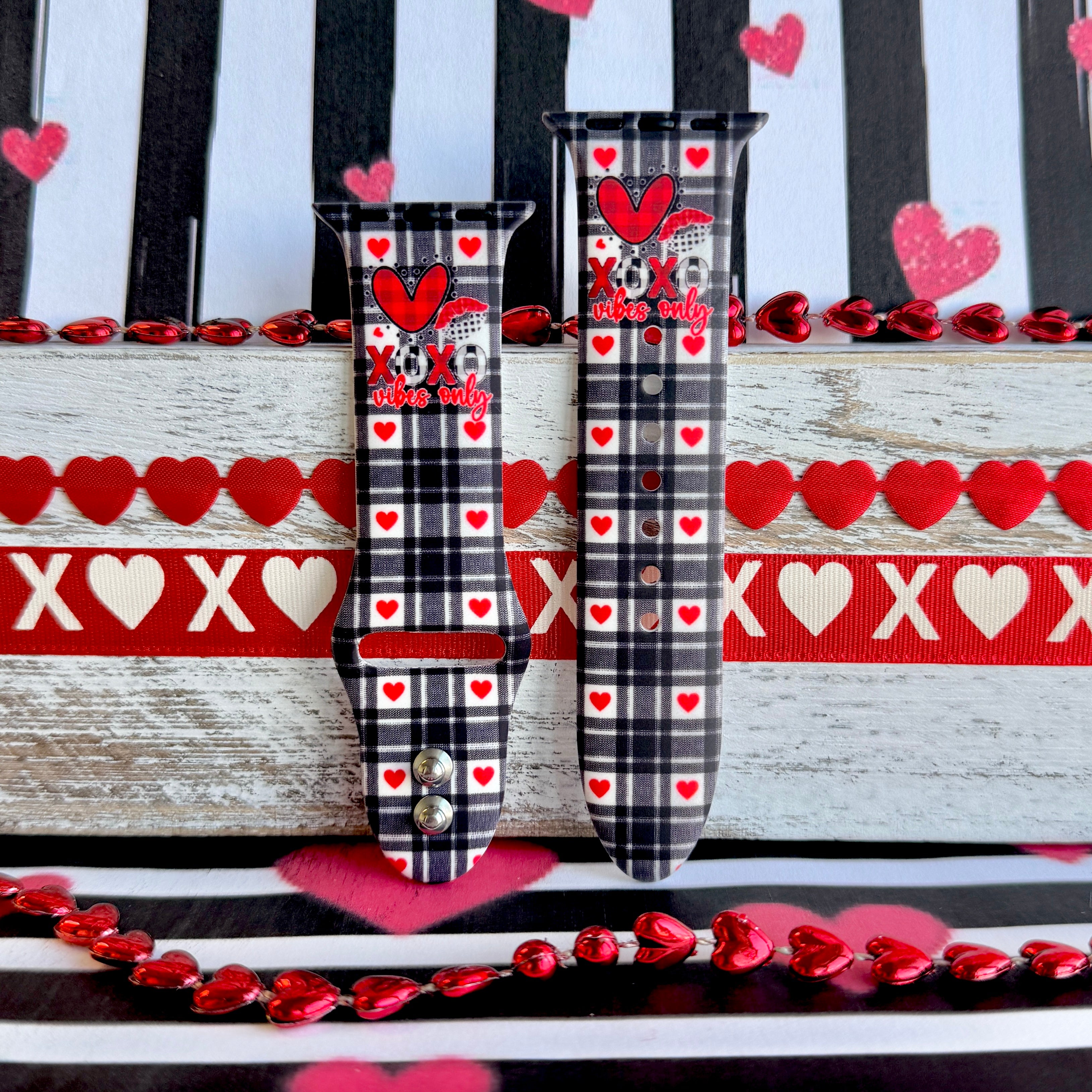 Plaid Crush Vibes Apple Watch band with black buffalo check, red hearts, and XOXO Vibes Only message with Valentine's decorations
