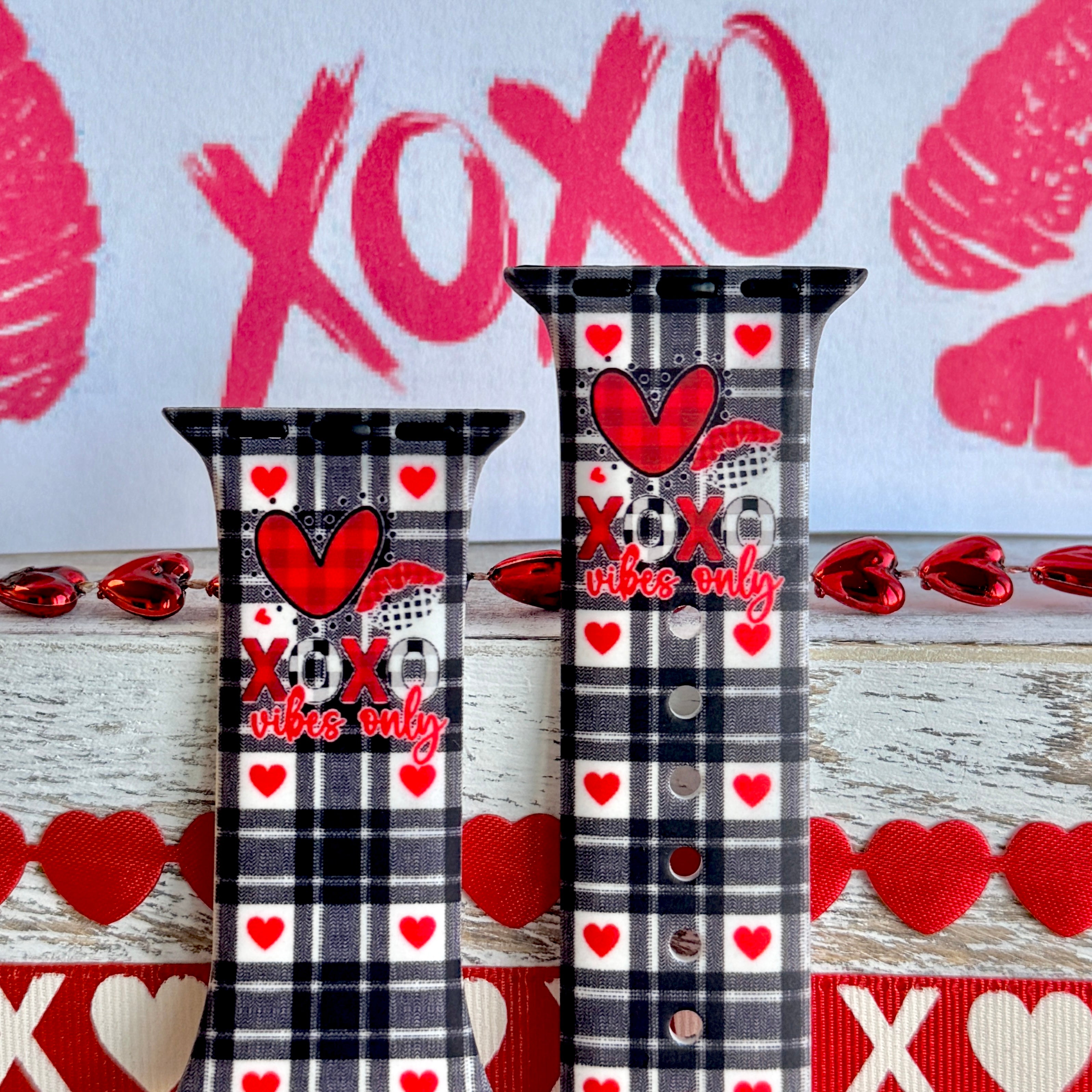 Plaid Crush Vibes Apple Watch band with black buffalo check, red hearts, and XOXO Vibes Only message with Valentine's decorations
