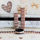 Sweet Espresso Stripes silicone Samsung Galaxy Watch band shown with a rose gold Galaxy Watch, both strap halves standing upright to display the espresso brown and cream stripes.