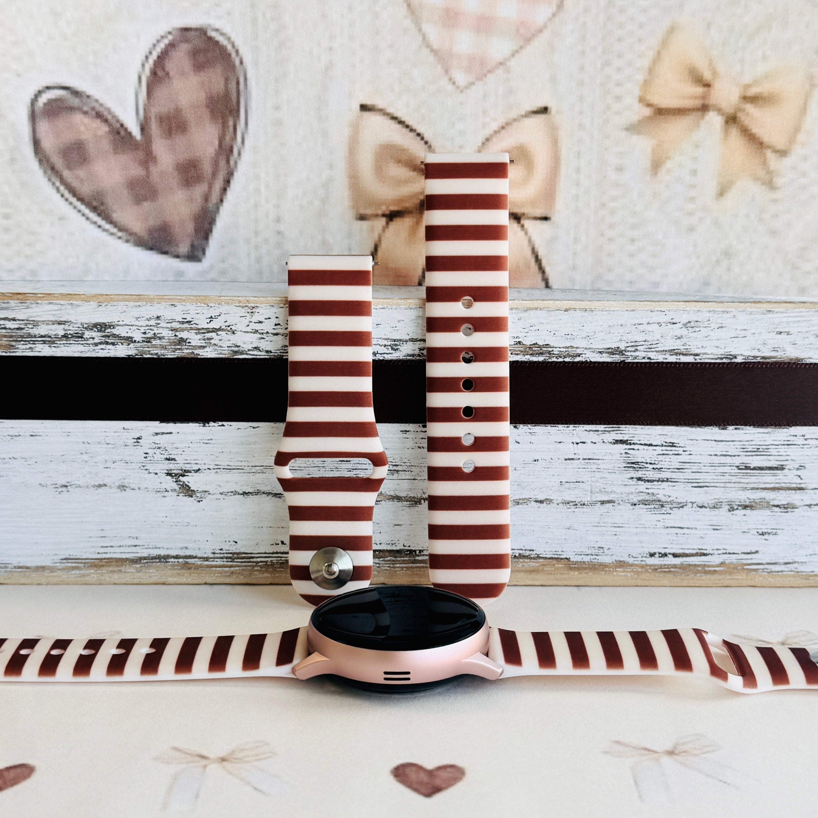 Sweet Espresso Stripes silicone Samsung Galaxy Watch band shown with a rose gold Galaxy Watch, both strap halves standing upright to display the espresso brown and cream stripes.
