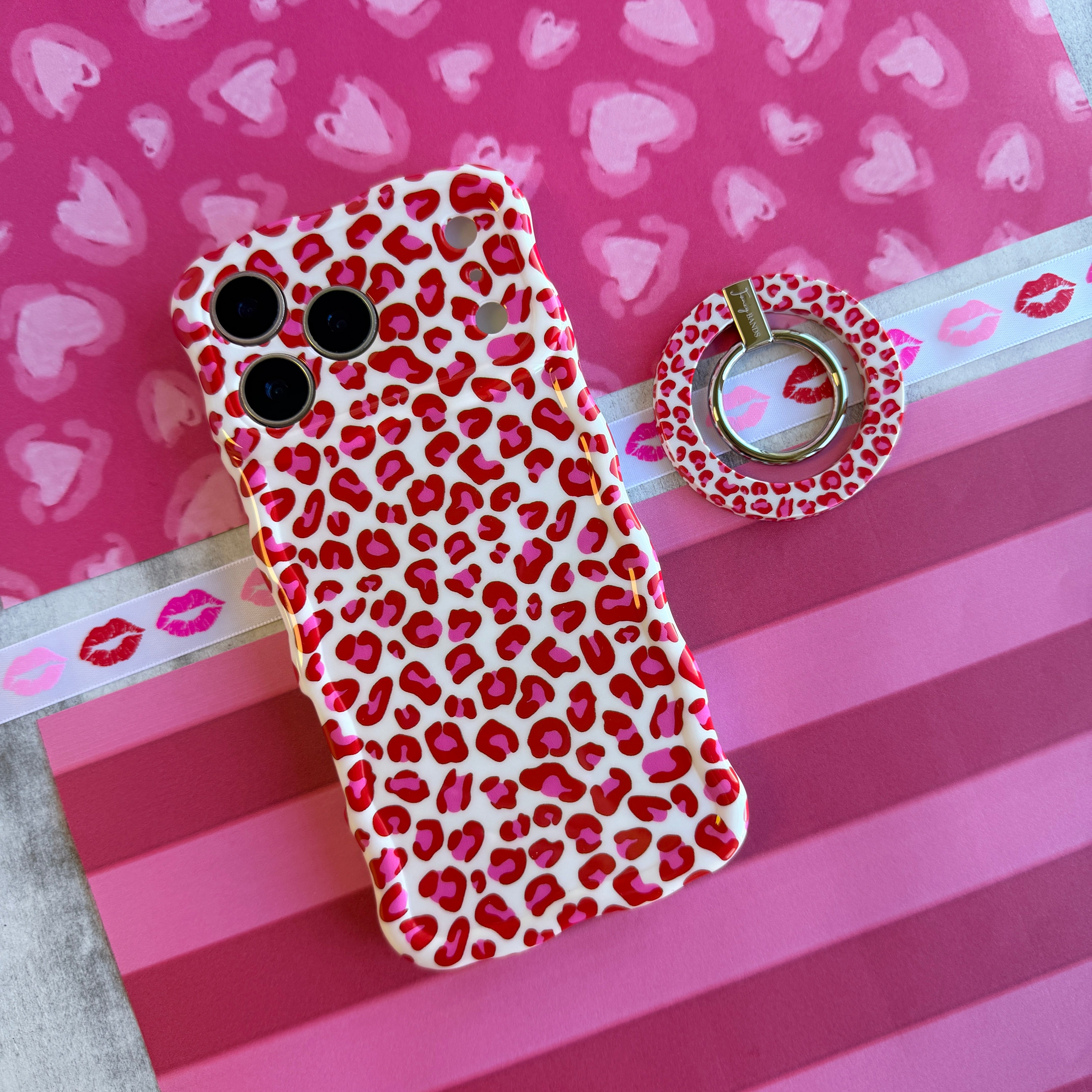 Leopard Crush pattern MagSafe phone grip ring with vibrant pink and red leopard spots on white background compatible with iPhone and Samsung