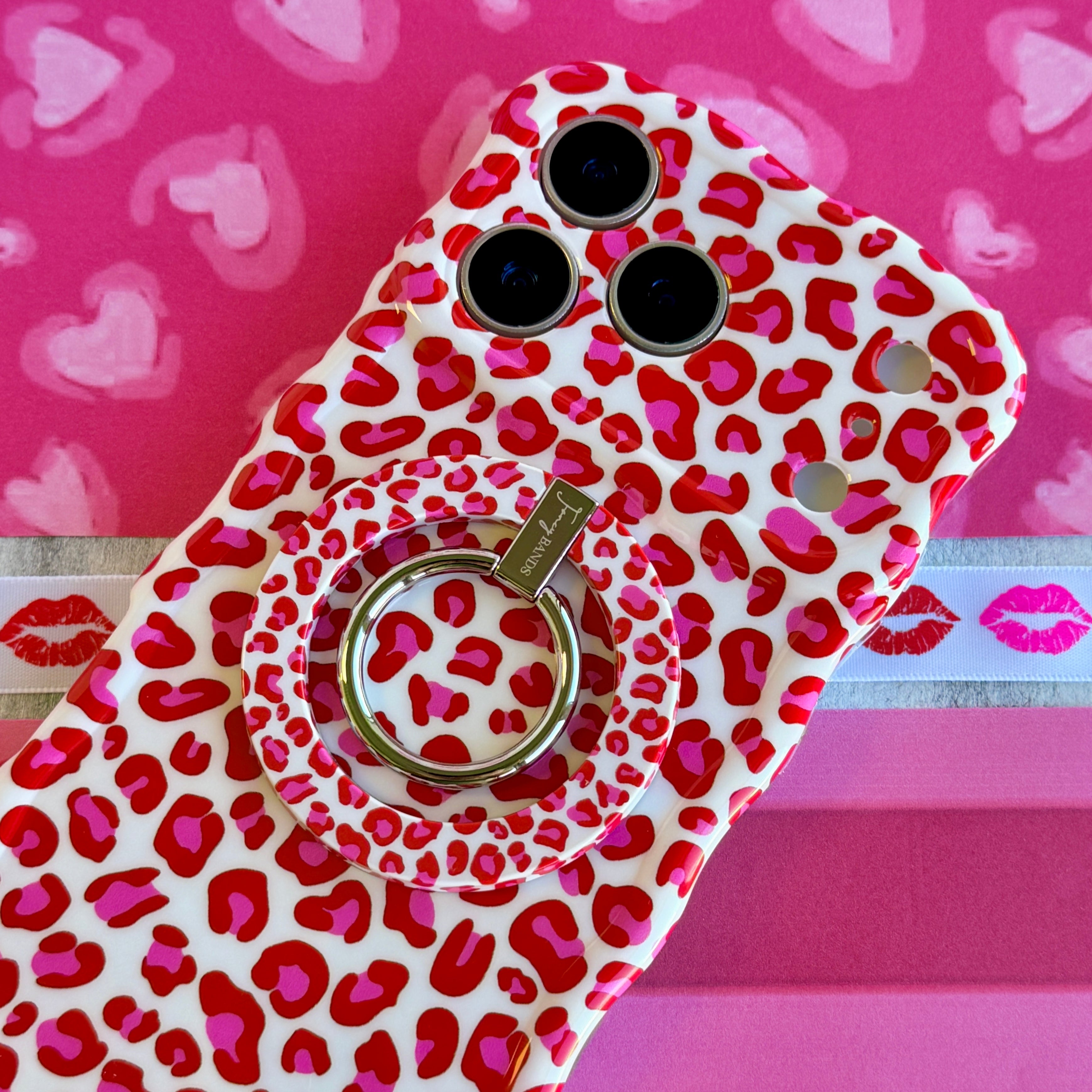 Leopard Crush pattern MagSafe phone grip ring with vibrant pink and red leopard spots on white background compatible with iPhone and Samsung