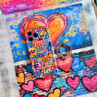 Love Riot graffiti street art MagSafe phone grip ring with colorful love text in pink teal and yellow on white background compatible with iPhone and Samsung