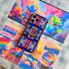 Stained Glass Dreams kaleidoscopic mosaic pattern MagSafe phone grip ring with vibrant purple teal and orange colors compatible with iPhone and Samsung
