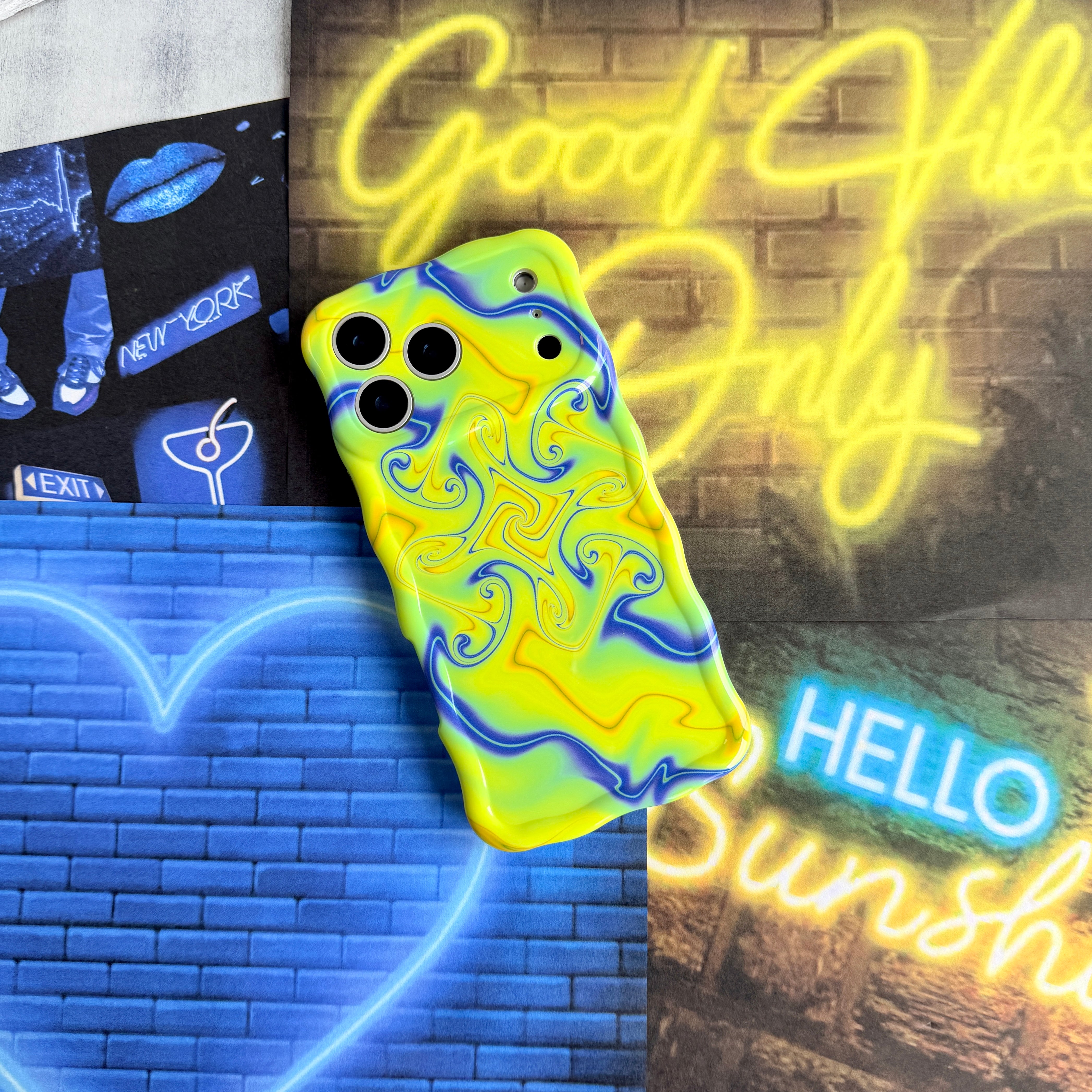 Trendy wavy iPhone case featuring an electric neon yellow and blue liquid swirl psychedelic pattern with a high-gloss finish.