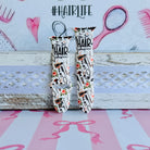 Hair Whisperer Apple Watch band with hairstyling tools, scissors, combs, and roses on white background with #HAIRLIFE backdrop
