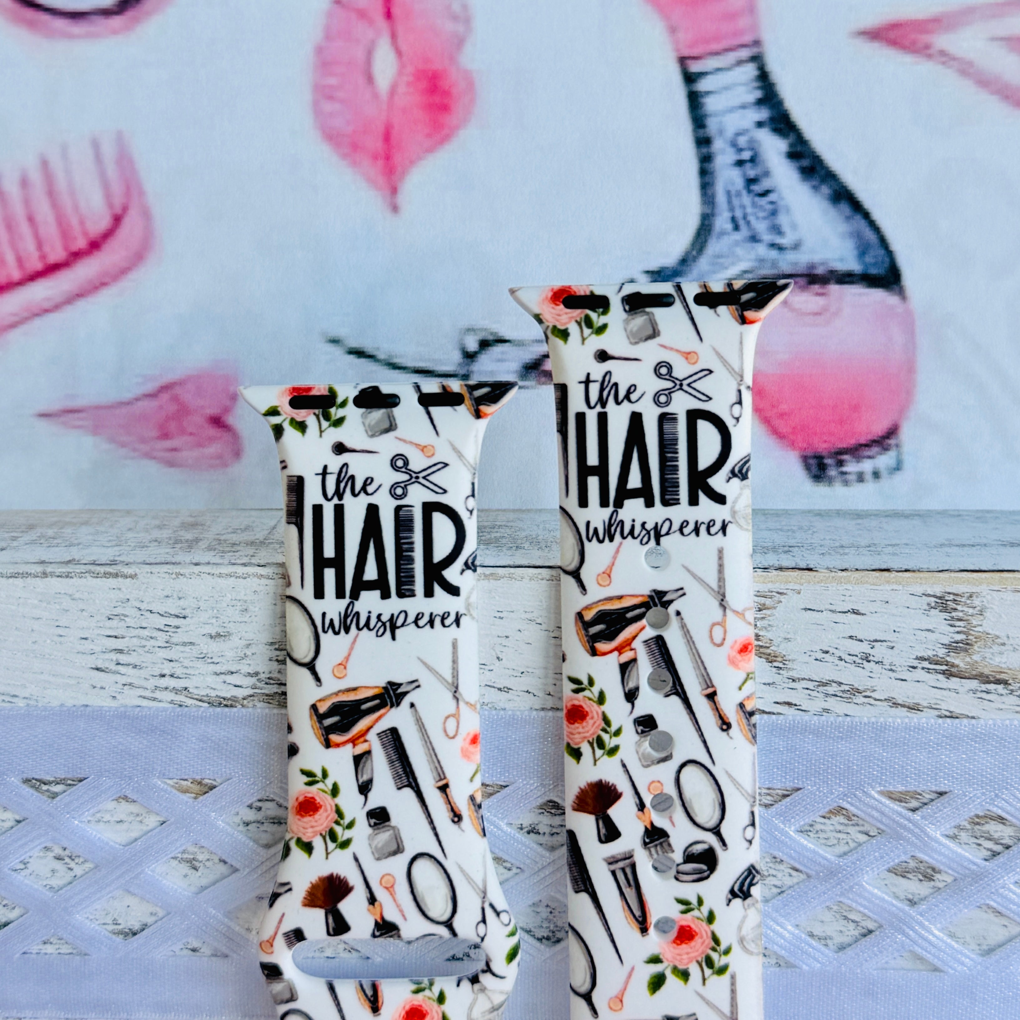 Hair Whisperer Apple Watch band with hairstyling tools, scissors, combs, and roses on white background with #HAIRLIFE backdrop
