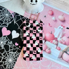Hey Boo, Looking Cute Wavy Luxe MagSafe iPhone case in pink and black checkerboard with white ghosts, bats and spider webs