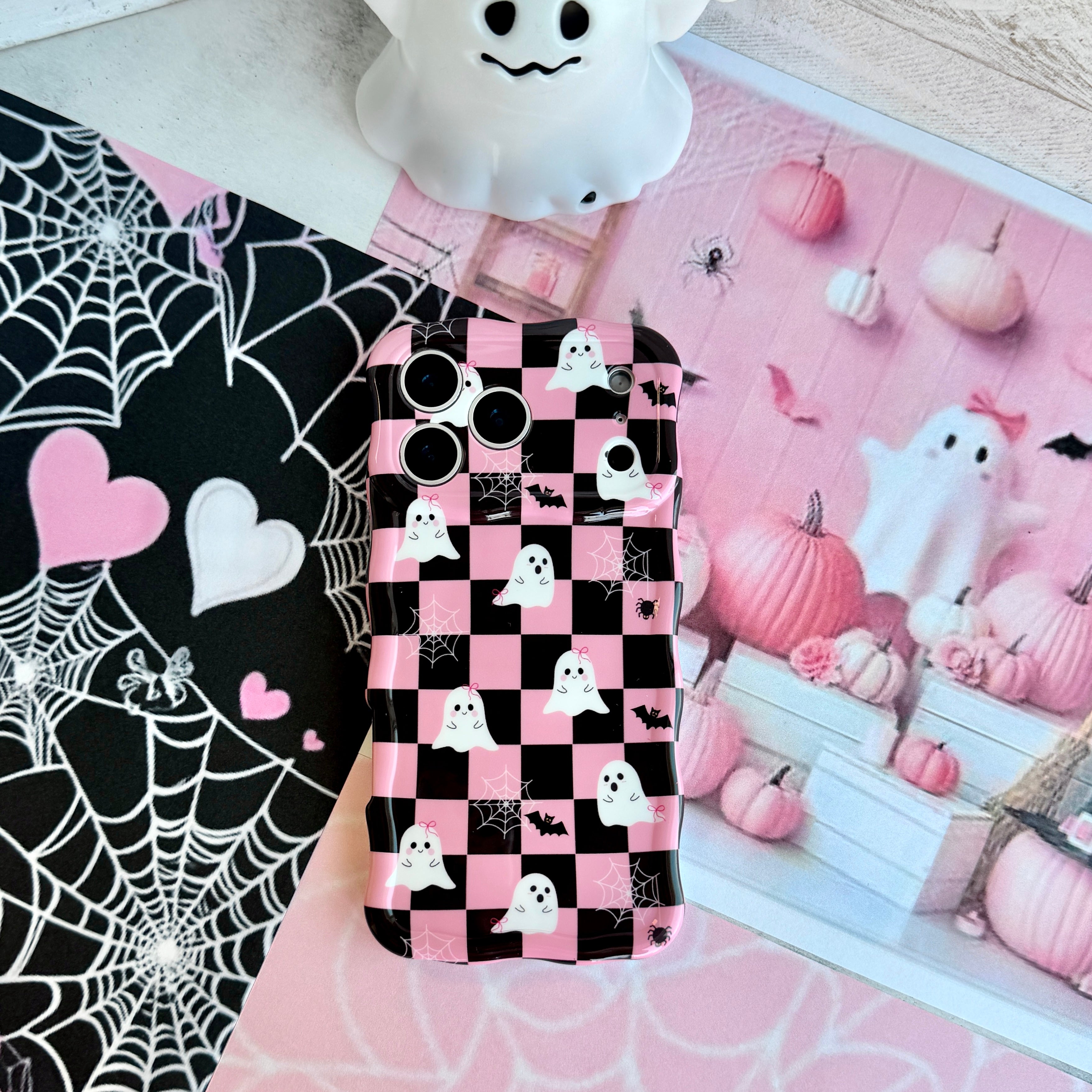Hey Boo, Looking Cute Wavy Luxe MagSafe iPhone case in pink and black checkerboard with white ghosts, bats and spider webs