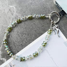 Bow & Bling Fancy Phone Charm â Bow & Bling Phone Charm - Iridescent & Emerald Beaded Phone Wrist Strap Put a bow on it and make it sparkle!