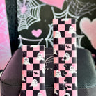 Both sizes of the Hey Boo, Looking Cute Samsung Galaxy Watch band leaning together, close view of the checkerboard ghost and bat print.