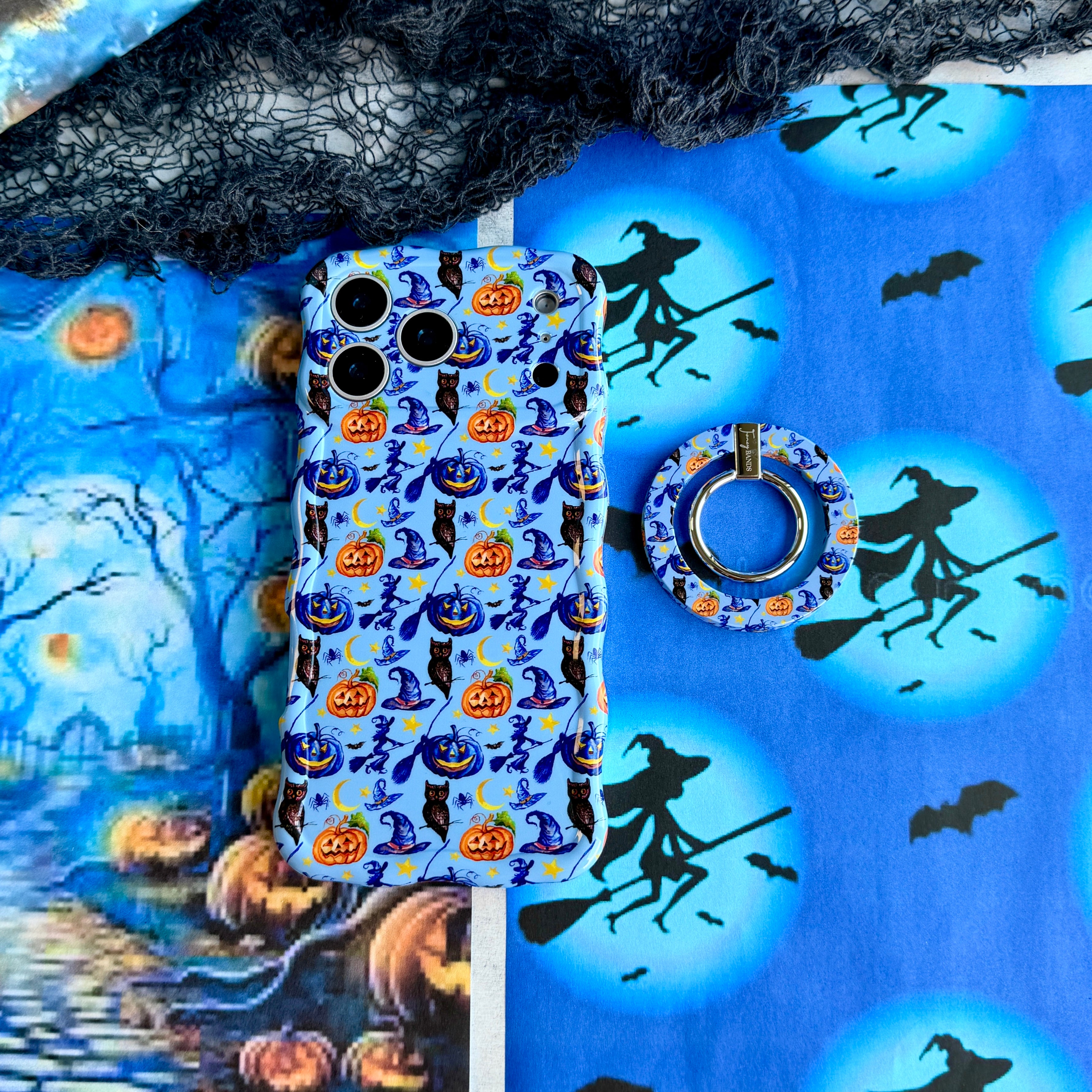 The Bewitching Hour Hold It Fancy MagSafe grip ring attached to the matching periwinkle witch-print iPhone case