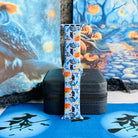 The Bewitching Hour silicone Apple Watch band standing upright on a black stand, showing the light blue witch hat and owl print full length.
