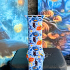 The Bewitching Hour Apple Watch band displayed upright, light blue silicone with painted jack-o-lanterns, owls and yellow crescent moons.