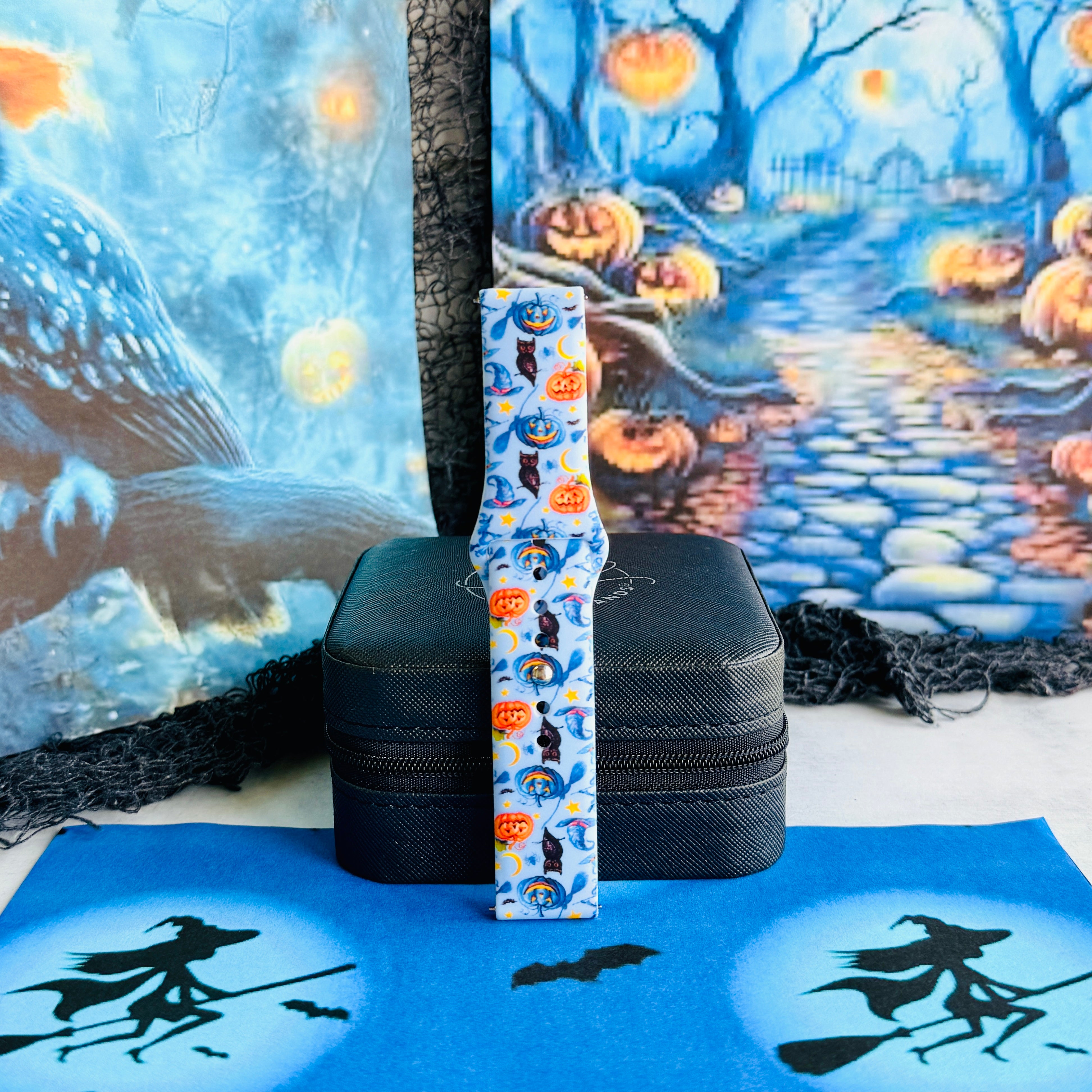 The Bewitching Hour Samsung Galaxy Watch band standing upright against a moonlit blue Halloween forest backdrop.
