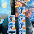 Both sizes of The Bewitching Hour Samsung Galaxy Watch band side by side, close view of the jack-o-lantern, witch hat and owl print.