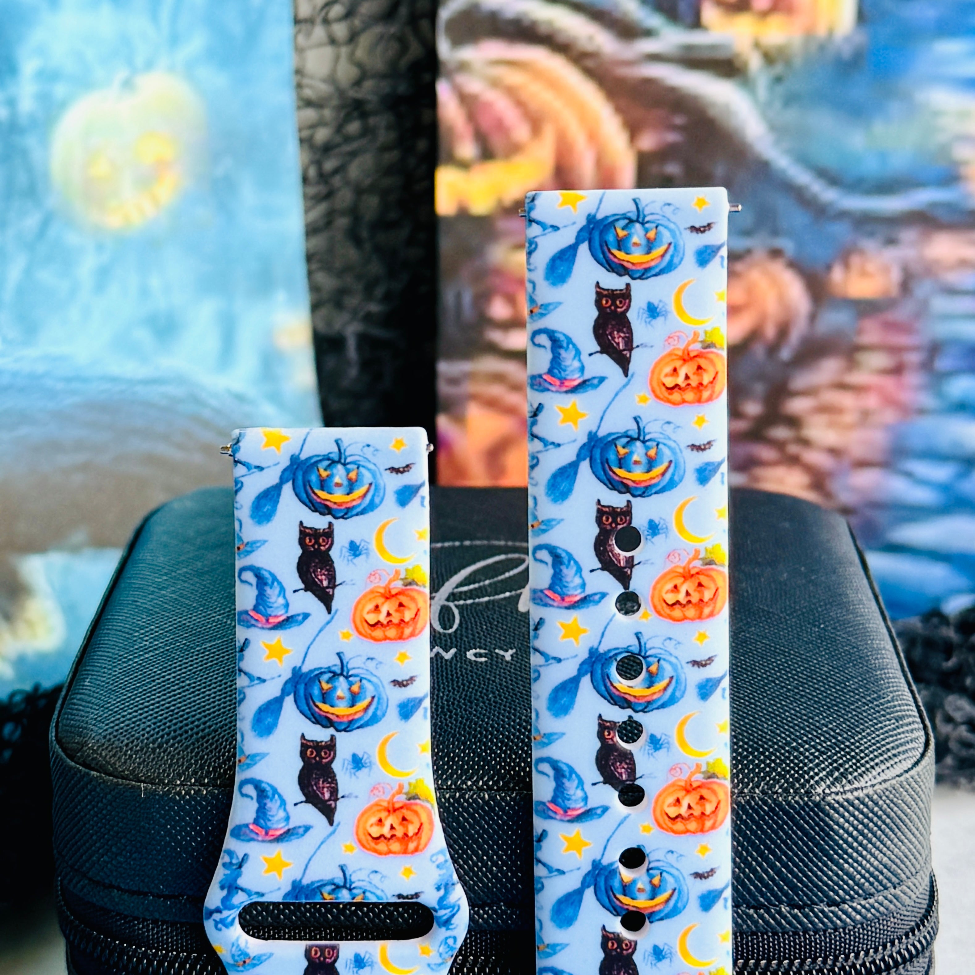 Both sizes of The Bewitching Hour Samsung Galaxy Watch band side by side, close view of the jack-o-lantern, witch hat and owl print.