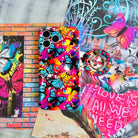 Rebel Wings graffiti butterfly MagSafe phone grip ring with electric blue butterflies, pink and orange paint splatters, and grunge street art design compatible with iPhone and Samsung
