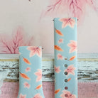 Both sizes of the Autumn Breeze Samsung Galaxy Watch band side by side, close view of the blush maple leaves and coral wheat sprigs.