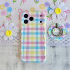 Pastel gingham phone ring grip used as kickstand for hands-free viewing