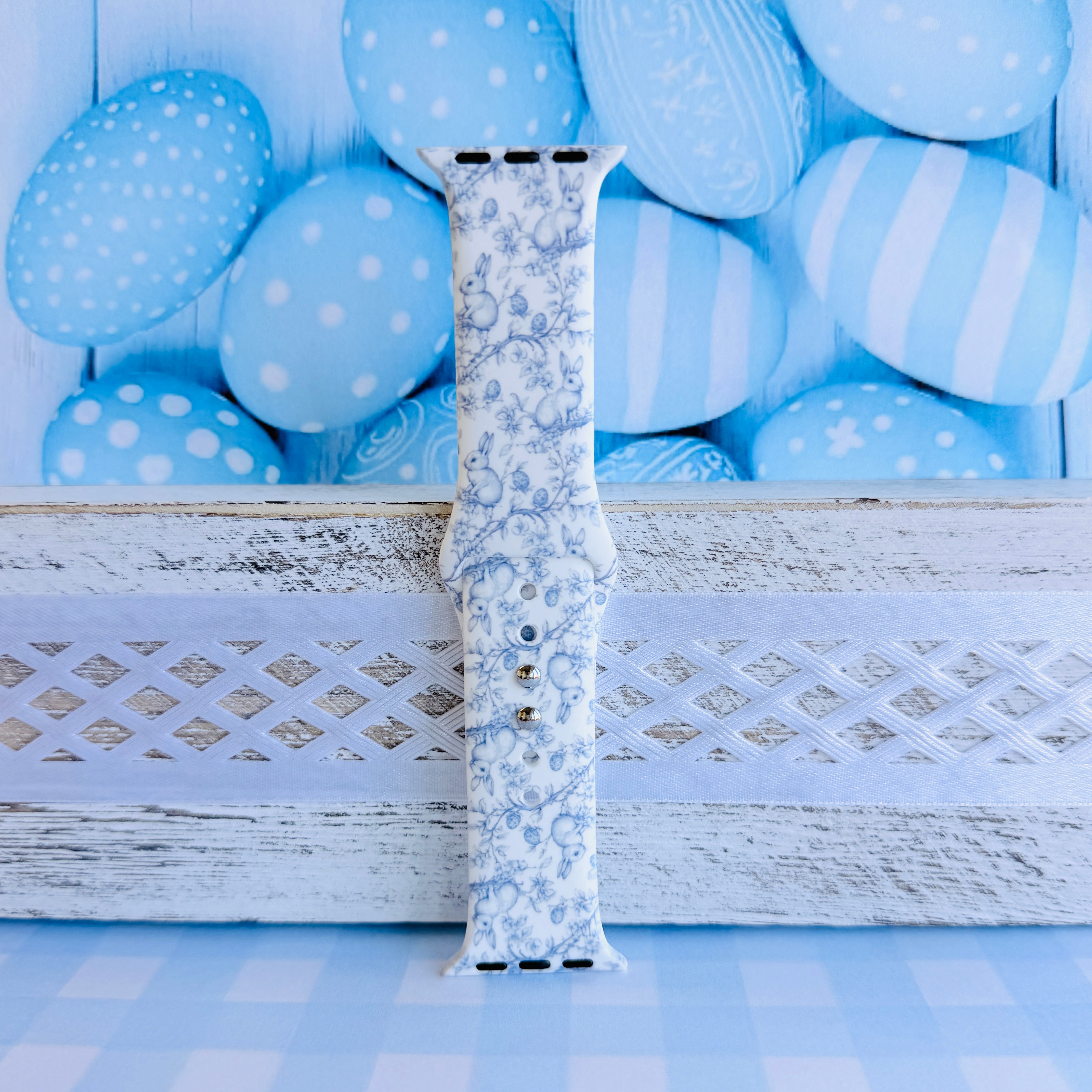 Bluebell Bunny Apple Watch band with blue floral pattern and bunny silhouettes on white background with blue balloons
