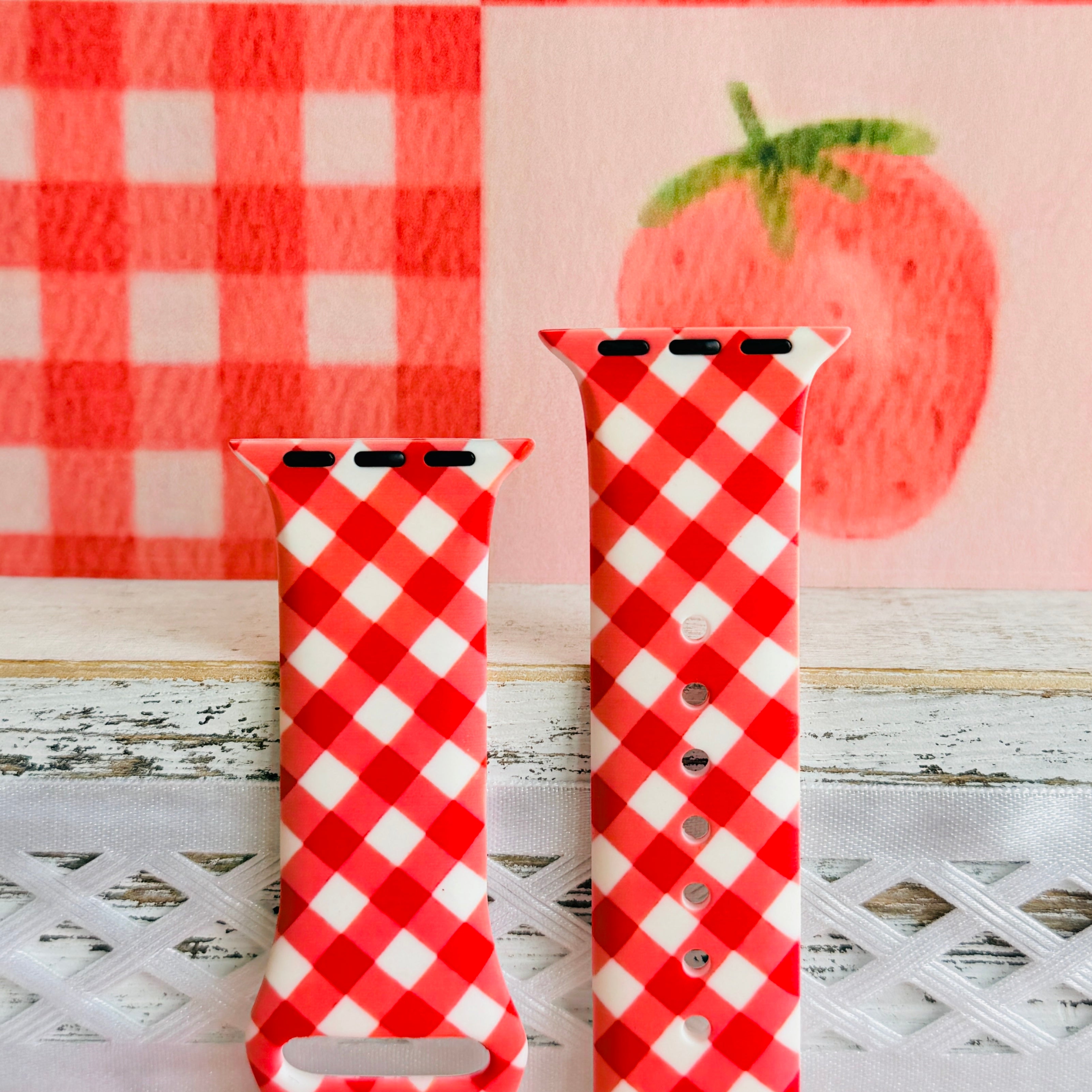 Both sizes of the Red Barn Babe Apple Watch band side by side, close view of the diagonal red and white gingham check.