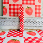 Red Barn Babe Samsung Galaxy Watch band standing full length against a red gingham and strawberry backdrop.