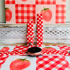 Red Barn Babe silicone Samsung Galaxy Watch band shown in both sizes with a round Samsung watch at the base, red and white gingham cut on the bias.