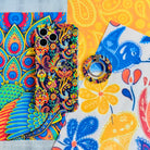 Paisley Birdsong bohemian MagSafe phone grip ring with intricate jewel-toned paisley, flowers, and birds on a deep navy background compatible with iPhone and Samsung