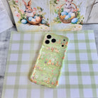 Sage green wavy iPhone case featuring a vintage watercolor pattern of bunnies, Easter eggs, and spring flowers.
