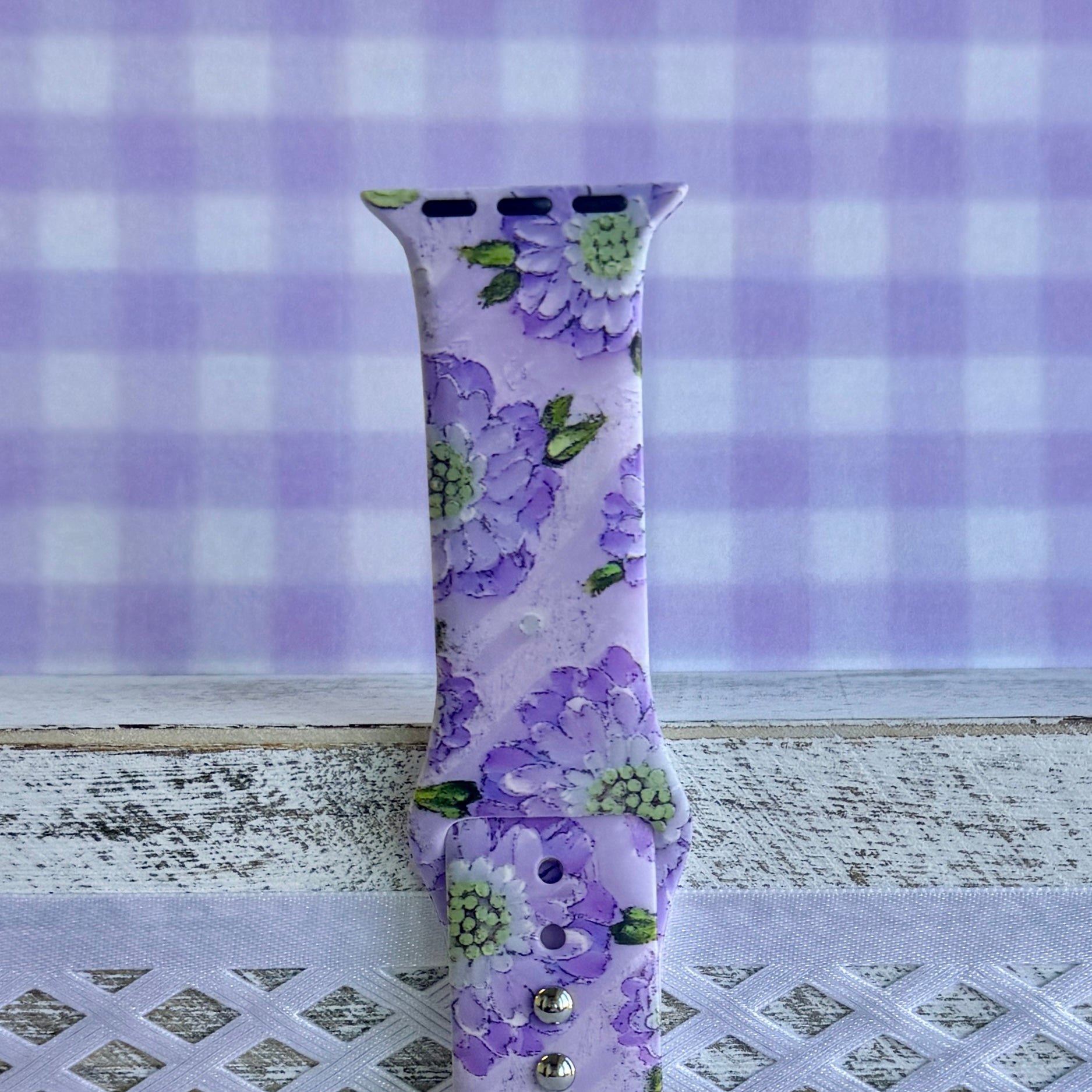 Purple Wildflower Apple Watch band with delicate lavender and purple blooms on lilac background with fresh flowers
