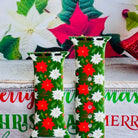 Close-up of Poinsettia Pines print showing vibrant red flowers, white blooms, and lush green pine on Apple Watch silicone band
