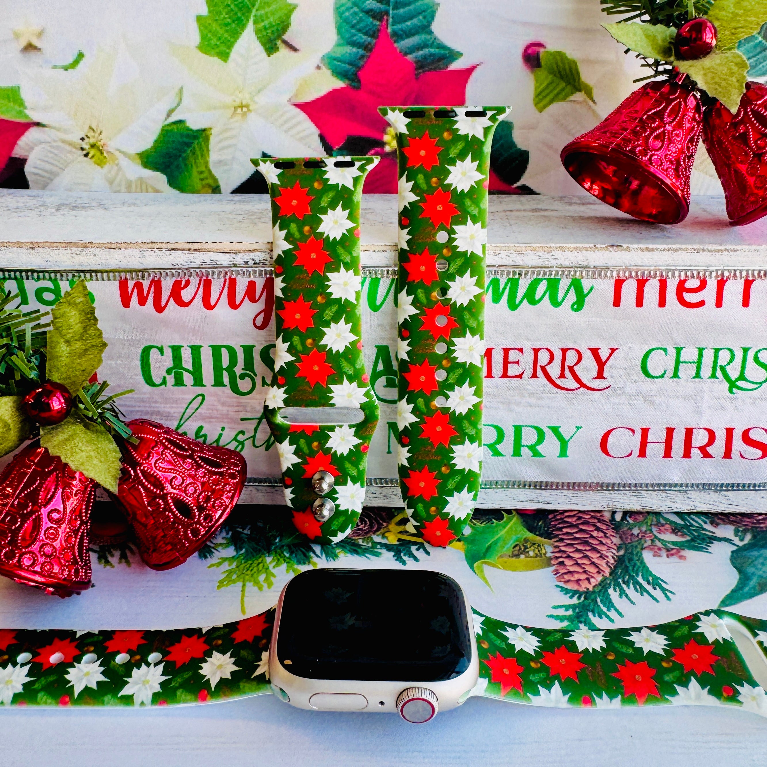 Poinsettia Pines Apple Watch band with red and white poinsettia flowers and green pine branches with Christmas decorations

