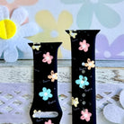 Flower Pop Apple Watch band with pastel flowers in pink, yellow, turquoise, and peach on black background with daisy decorations
