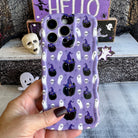 Ghostly Whiskers wavy iPhone MagSafe case on lavender with black cats and ghosts