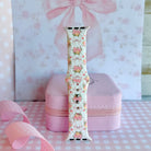 Ribbons & Roses Apple Watch band with pink roses and ribbon bows on cream background with pink rose and ribbon decorations

