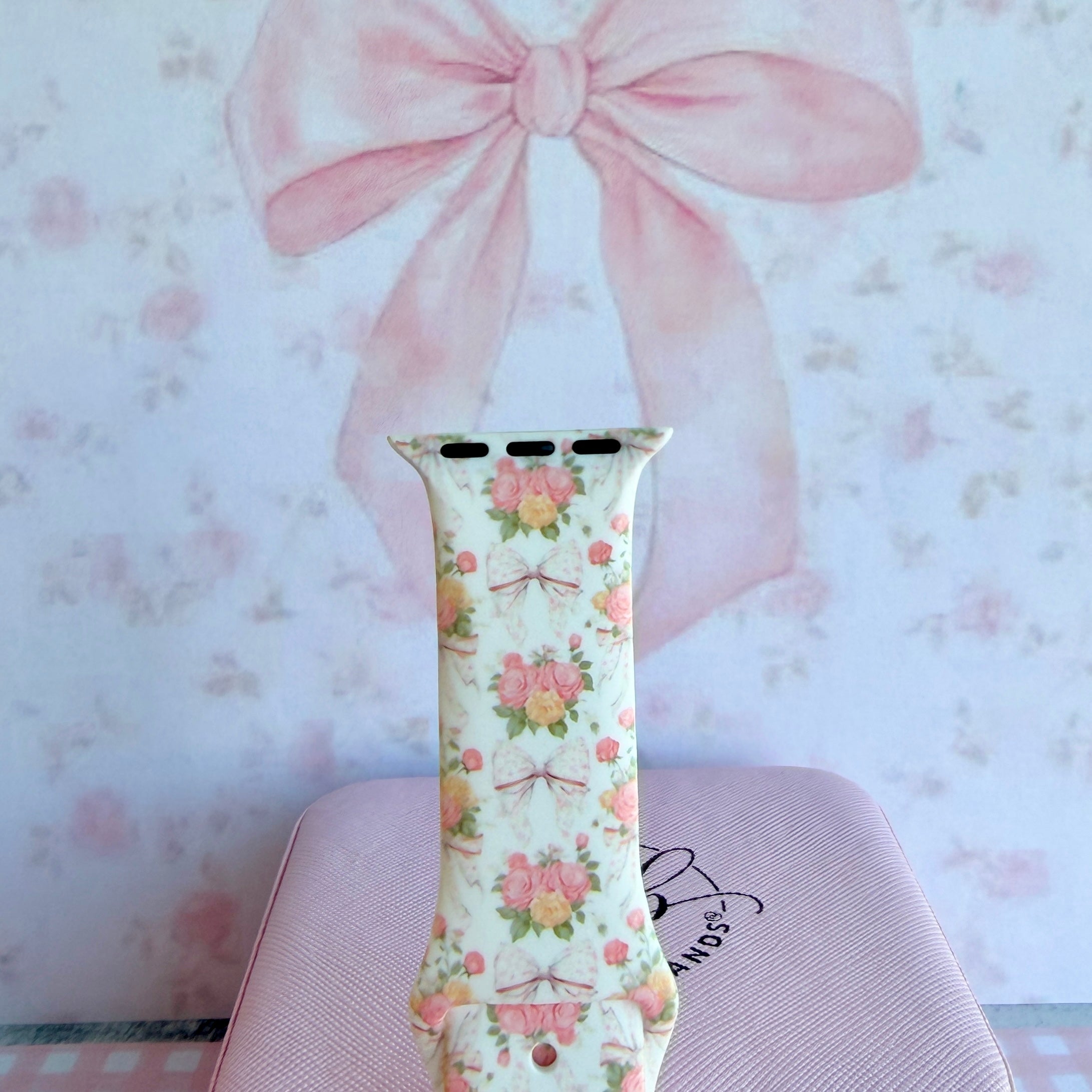 Ribbons & Roses Apple Watch band with pink roses and ribbon bows on cream background with pink rose and ribbon decorations
