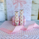 Ribbons & Roses Apple Watch band with pink roses and ribbon bows on cream background with pink rose and ribbon decorations
