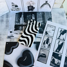 Wavy iPhone case featuring a bold black and white swirly striped pattern with a high-gloss finish.