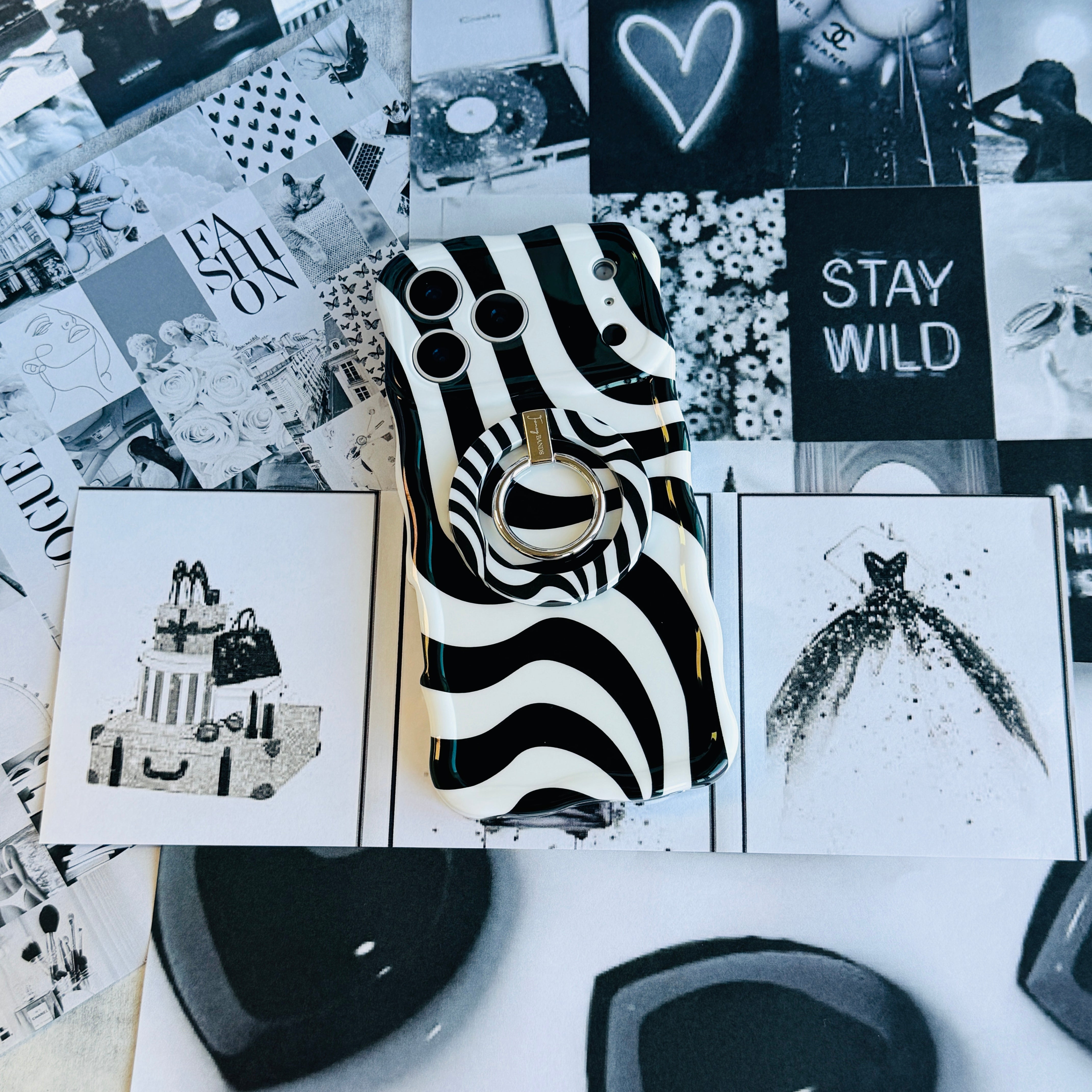 Wavy iPhone case featuring a bold black and white swirly striped pattern with a high-gloss finish.