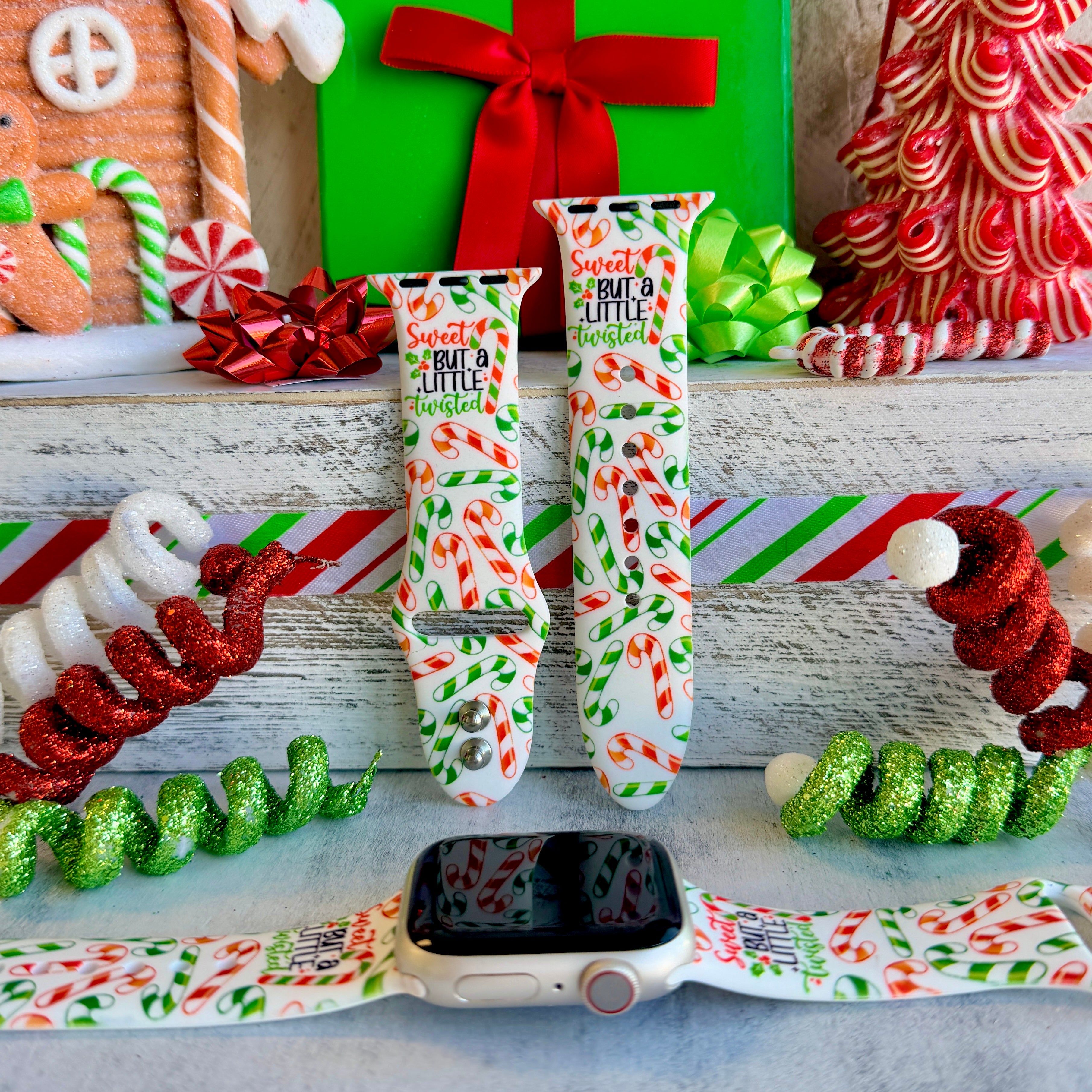Apple Watch with Twistmas Vibes candy cane band next to size comparison
