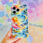 Trendy wavy iPhone case featuring a vibrant celestial surrealism design of a golden sun, crescent moon, and pastel watercolor clouds with a high-gloss finish.
