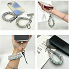 A Coastal Catch scrunchie phone wrist strap featuring a blue tile, orange lobster, and yellow lemon pattern attached to a matching Wavy Luxe phone case on a blue and white striped background.