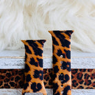 Rawr Mode Apple Watch band with bold tan and black leopard print pattern on white fur background
