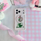 Pretty in PinkMas Hold It Fancy MagSafe grip ring snapped onto the matching pink striped iPhone case, on pink gingham paper