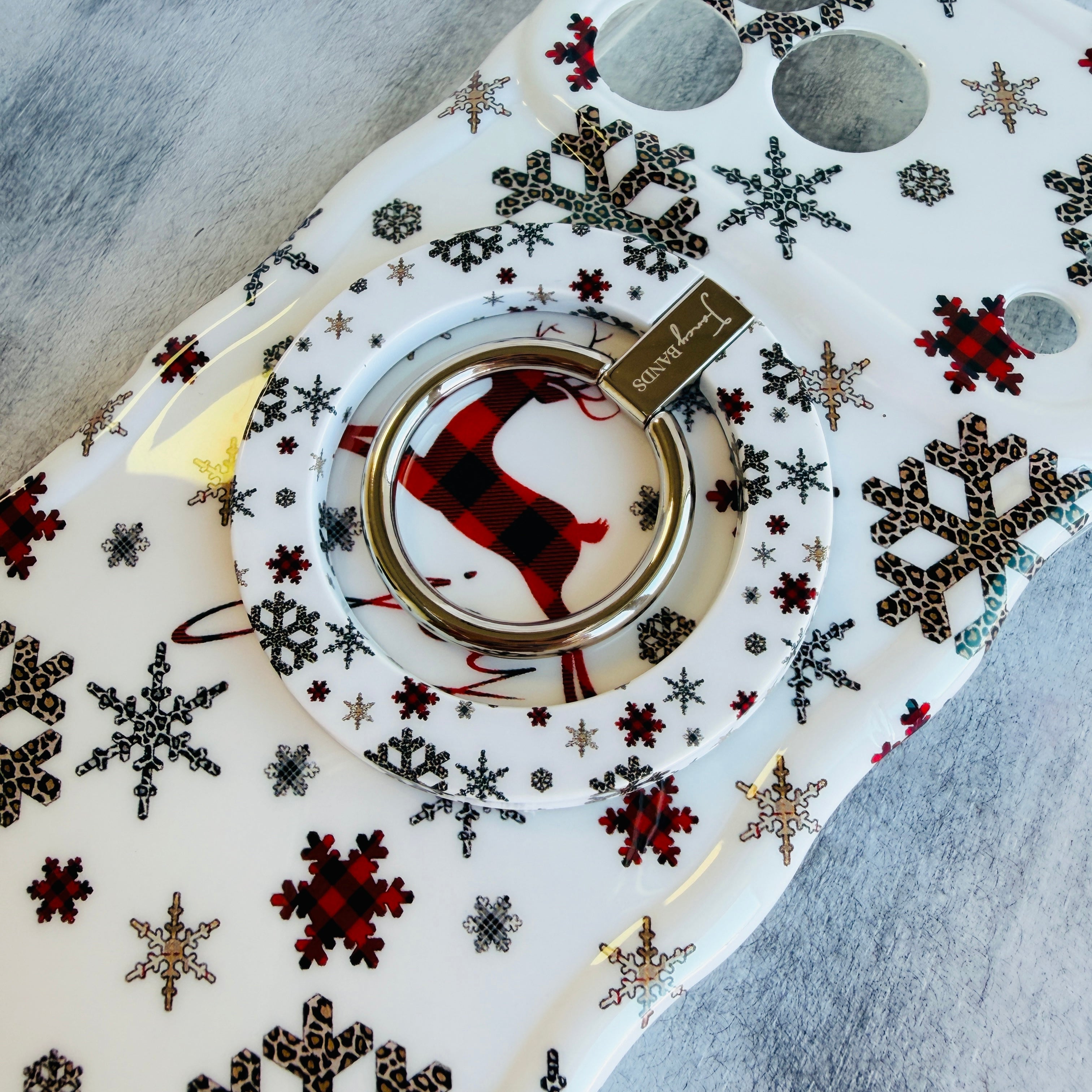 Elegant reindeer MagSafe phone ring stand with ice blue background
